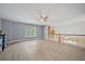 Bright bonus room features hardwood floors, natural light, and a ceiling fan at 4505 Lakefield Bnd, Berkeley Lake, GA 30096