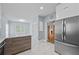 Bright kitchen featuring stainless steel appliances, marble counters and tile floors at 4505 Lakefield Bnd, Berkeley Lake, GA 30096