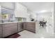 Contemporary kitchen boasting stylish countertops, cabinetry, and stainless appliances at 4505 Lakefield Bnd, Berkeley Lake, GA 30096