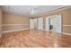 Spacious main bedroom with hardwood floors, tray ceiling, and access to the ensuite bath at 4505 Lakefield Bnd, Berkeley Lake, GA 30096