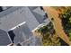 Overhead view of the home, showing the roof, driveway, and surrounding landscape with mature trees at 4573 Caleb Xing # 20, Powder Springs, GA 30127