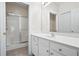 Clean bathroom with white cabinets, ample counter space, and a glass-enclosed shower at 4573 Caleb Xing # 20, Powder Springs, GA 30127