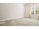 Bright bedroom with neutral carpet, light-filled window, and classic curtains at 4573 Caleb Xing # 20, Powder Springs, GA 30127