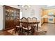 Dining area adjacent to the kitchen with hardwood floors, traditional-style table and china cabinet at 4573 Caleb Xing # 20, Powder Springs, GA 30127