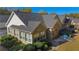 Rear exterior view of home, showcasing its brick facade, windows, and well-maintained landscaping at 4573 Caleb Xing # 20, Powder Springs, GA 30127