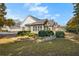 Exterior view of a home featuring brick and siding, surrounded by mature trees and landscaping at 4573 Caleb Xing # 20, Powder Springs, GA 30127