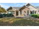 Charming home with stone accents, arched windows, and a cozy front patio at 4573 Caleb Xing # 20, Powder Springs, GA 30127