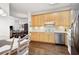 Spacious kitchen with stainless steel appliances, ample counter space and view to the eat-in kitchen area at 4573 Caleb Xing # 20, Powder Springs, GA 30127