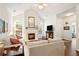 Inviting living room with a fireplace, vaulted ceiling, and large windows at 4573 Caleb Xing # 20, Powder Springs, GA 30127