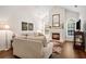 Comfortable living room featuring a fireplace, large windows, and stylish decor at 4573 Caleb Xing # 20, Powder Springs, GA 30127