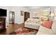 Spacious living room with hardwood floors and an open concept to the dining and kitchen areas at 4573 Caleb Xing # 20, Powder Springs, GA 30127