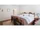Relaxing main bedroom featuring a wooden bed, side tables, and decorative lamps at 4573 Caleb Xing # 20, Powder Springs, GA 30127