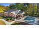 Community pool house with a pool covered, with outdoor cooking area and seating for residents at 4573 Caleb Xing # 20, Powder Springs, GA 30127