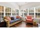 Bright sunroom with large windows providing lots of natural light and views of the outdoors at 4573 Caleb Xing # 20, Powder Springs, GA 30127