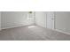 Neutral carpeted bedroom with natural light, fresh paint, and a clean, minimalist aesthetic at 313 Ellenwood Dr, Bowdon, GA 30108