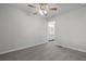 Neutral bedroom featuring carpet and view of ensuite bath with double vanity sinks at 313 Ellenwood Dr, Bowdon, GA 30108
