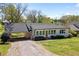 Charming single-story home with a covered carport and well-maintained front lawn at 313 Ellenwood Dr, Bowdon, GA 30108