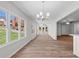 Spacious sunroom featuring large windows, hardwood floors, and bright natural light at 313 Ellenwood Dr, Bowdon, GA 30108