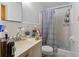 Bathroom featuring a vanity, toilet, and walk-in shower with curtain at 3944 Woburn Dr, Tucker, GA 30084