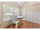 Bright dining area with large windows, wood floors, and built-in storage at 3944 Woburn Dr, Tucker, GA 30084