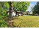 Charming home with a well-maintained front lawn, classic architecture, and welcoming curb appeal at 3944 Woburn Dr, Tucker, GA 30084