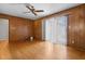 A living room featuring hardwood floors, wood paneling, and natural light at 3944 Woburn Dr, Tucker, GA 30084