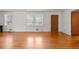A bright living room featuring hardwood floors and multiple windows at 3944 Woburn Dr, Tucker, GA 30084