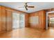 Living room with hardwood floors, wood paneling, and a sliding glass door at 3944 Woburn Dr, Tucker, GA 30084