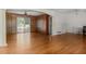 Spacious living room with hardwood floors, ceiling fan, and sliding glass doors to the backyard at 3944 Woburn Dr, Tucker, GA 30084