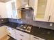 Close-up of kitchen featuring granite countertops, stainless steel appliances, and subway tile backsplash at 505 Tilbury Dr, Suwanee, GA 30024
