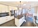 Kitchen featuring white cabinets, stainless steel appliances, dark countertops, and tile backsplash at 505 Tilbury Dr, Suwanee, GA 30024