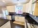 Kitchen featuring white cabinets, stainless steel appliances, granite countertops, and tile backsplash at 505 Tilbury Dr, Suwanee, GA 30024