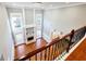 Bright living room featuring a fireplace, hardwood floors, and large window at 505 Tilbury Dr, Suwanee, GA 30024