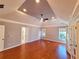 Spacious main bedroom boasts tray ceilings, hardwood floors, and large windows that flood the room with natural light at 505 Tilbury Dr, Suwanee, GA 30024