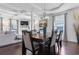 Dining room with modern light fixture, hardwood floors and large windows at 725 Mcwilliams Se Rd, Atlanta, GA 30315