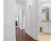 Hallway leads to a bathroom with light tile floors and a vanity with storage at 725 Mcwilliams Se Rd, Atlanta, GA 30315