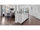 Open kitchen featuring granite countertops, white cabinets, stainless appliances, and island with bar seating at 725 Mcwilliams Se Rd, Atlanta, GA 30315