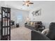 Living room featuring a ceiling fan and a comfortable seating area with natural light at 725 Mcwilliams Se Rd, Atlanta, GA 30315