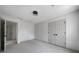 This bedroom offers neutral carpet, freshly painted walls, double door closet, and a modern ceiling light at 7771 A C Smith Rd, Cumming, GA 30028