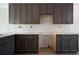 Kitchen featuring dark cabinets, white countertops, and subway tile backsplash at 7771 A C Smith Rd, Cumming, GA 30028