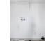 A laundry room with utility hookups and shelving ready for appliances and storage at 7771 A C Smith Rd, Cumming, GA 30028