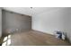Empty living room featuring wood paneling and hardwood floors at 7771 A C Smith Rd, Cumming, GA 30028