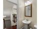 A half bathroom offering a pedestal sink and a view of the staircase at 2808 Broughton Se Ln, Atlanta, GA 30339