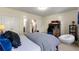 Bedroom with a cozy seating area, natural light, and access to the staircase at 2808 Broughton Se Ln, Atlanta, GA 30339