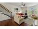Inviting living room boasts a beautiful bay window, natural light, and hardwood flooring at 2808 Broughton Se Ln, Atlanta, GA 30339