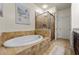 A luxurious main bathroom with a separate shower and soaking tub at 2808 Broughton Se Ln, Atlanta, GA 30339