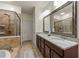 The main bathroom features granite counters, a separate shower, and a soaking tub at 2808 Broughton Se Ln, Atlanta, GA 30339