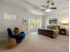 Spacious main bedroom with a tray ceiling, bay window, and comfy decor at 2808 Broughton Se Ln, Atlanta, GA 30339