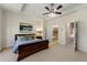 Spacious main bedroom with a tray ceiling and attached bathroom at 2808 Broughton Se Ln, Atlanta, GA 30339