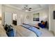 Bright main bedroom with a tray ceiling, ceiling fan, and ensuite bath at 2808 Broughton Se Ln, Atlanta, GA 30339
